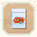 Visuel du cahier spiracle illustré d'une bande de momotes