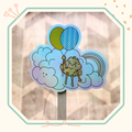 Un sticker holographique d'une momote dans les nuages