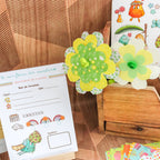 Visuel des produits du jeu symbolique fleuriste avec stickets, fleurs et bon de livraison.