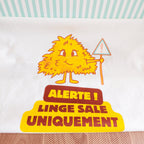 Zoom sur l'illustration du sac à linge sale Alerte linge sale uniquement avec une momote